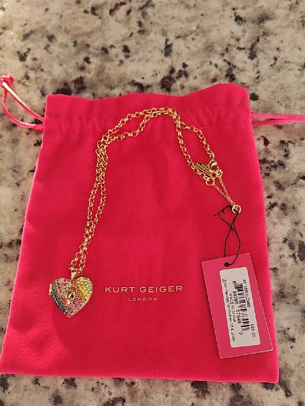 Kurt Geiger Gold-Tone Multicolor Crystal Heart Necklace on Pink Pouch